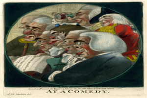 Gruppe von Menschen, die in einem Kreis bei einem Comedy-Event lachen, einer hält ein Blatt Papier.