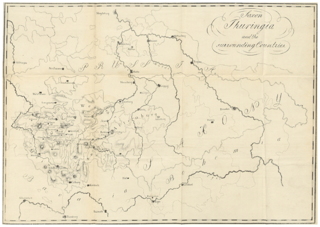 Eine Papierkarte des Königreichs Thüringen und umliegender Länder mit Grenzen und Text, der Regionen beschreibt.