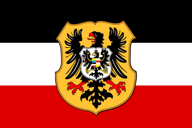 Eine waagrechte Flagge mit rot, weiß und schwarzen Streifen, die ein zentrales Logo eines doppelköpfigen Adlers zeigt.
