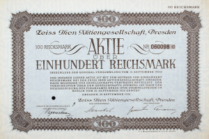 Alter deutscher Aktienchein für 100 Reichmark mit schwarzem Rand und deutschem Text.