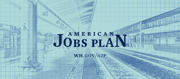 Entwurf einer Bahnhofstation mit der Aufschrift "American Jobs Plan" und einem Zug auf der rechten Seite.